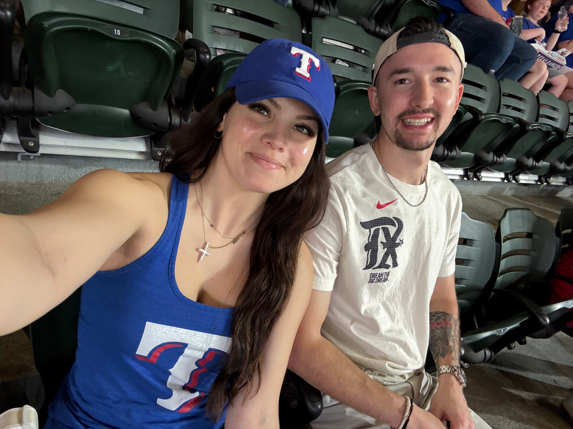 Hunter with a happy client at a Texas Rangers game